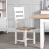 white wooden dining room chairs