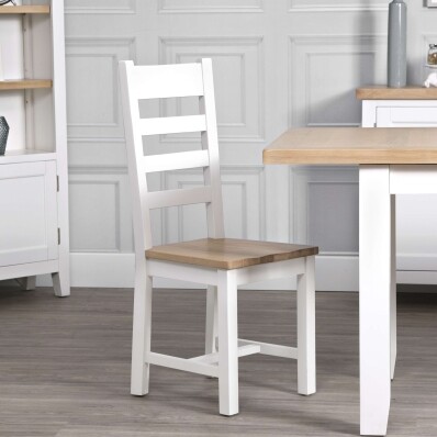 white wooden dining room chairs